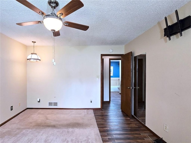 2101 Hillview Rd, Liberty, MO 64068 - spare room with a textured ceiling, ceiling fan, and wood finished floors