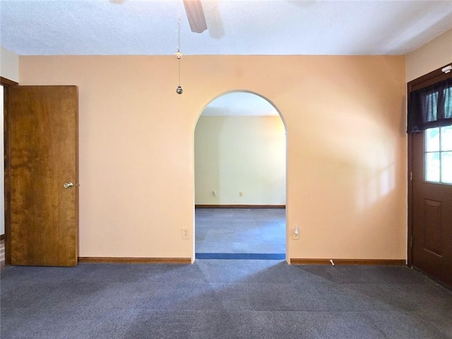 2101 Hillview Rd, Liberty, MO 64068 - carpeted entryway with ceiling fan and arched walkways