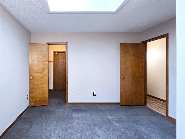 2101 Hillview Rd, Liberty, MO 64068 - unfurnished bedroom featuring a textured ceiling and carpet