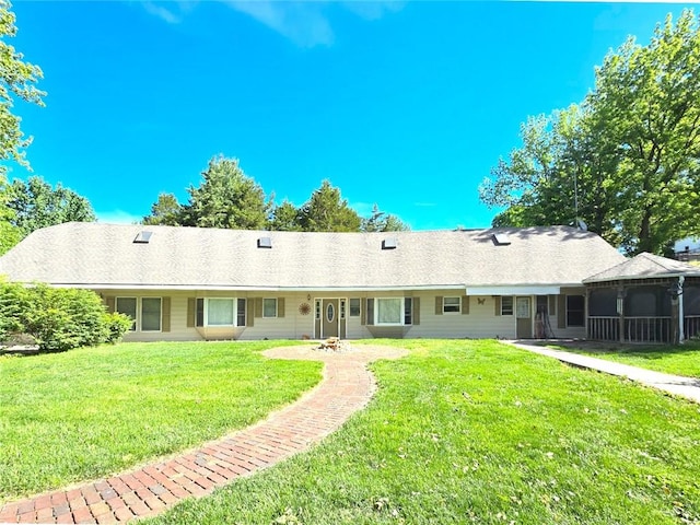 2101 Hillview Rd, Liberty, MO 64068 - back of house with a lawn and a sunroom