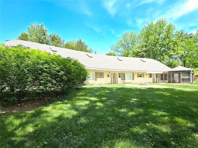 2101 Hillview Rd, Liberty, MO 64068 - rear view of house featuring a sunroom, a yard, and a patio