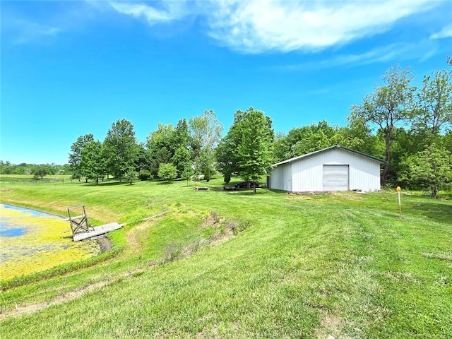 2101 Hillview Rd, Liberty, MO 64068 - view of grassy yard with a detached garage and an outdoor structure