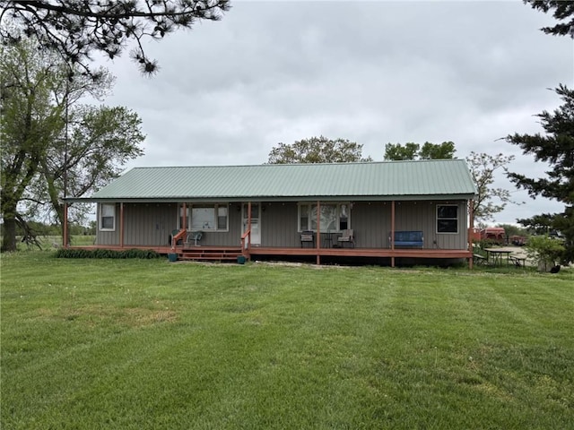 32592 SE 500th Rd, Kincaid, KS 66039 - view of front facade with a front lawn, a metal roof, and board and batten siding