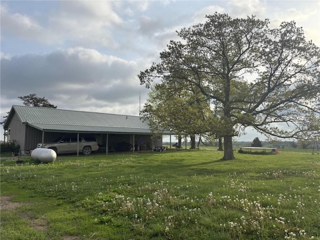 32592 SE 500th Rd, Kincaid, KS 66039 - view of grassy yard with a carport