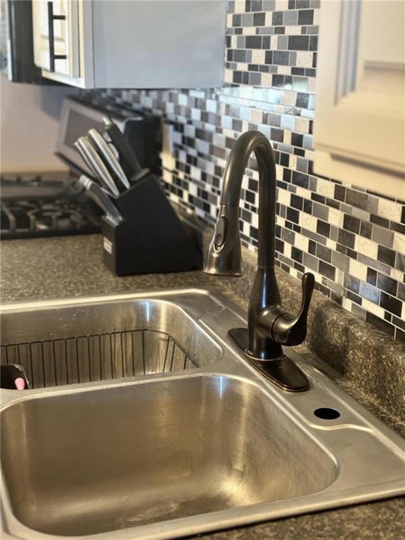32592 SE 500th Rd, Kincaid, KS 66039 - kitchen view of a sink and backsplash