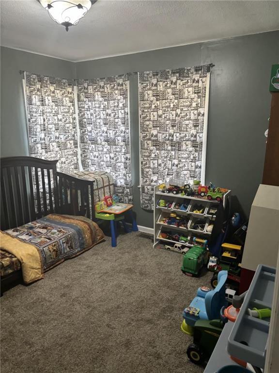 32592 SE 500th Rd, Kincaid, KS 66039 - bedroom featuring carpet flooring and a textured ceiling