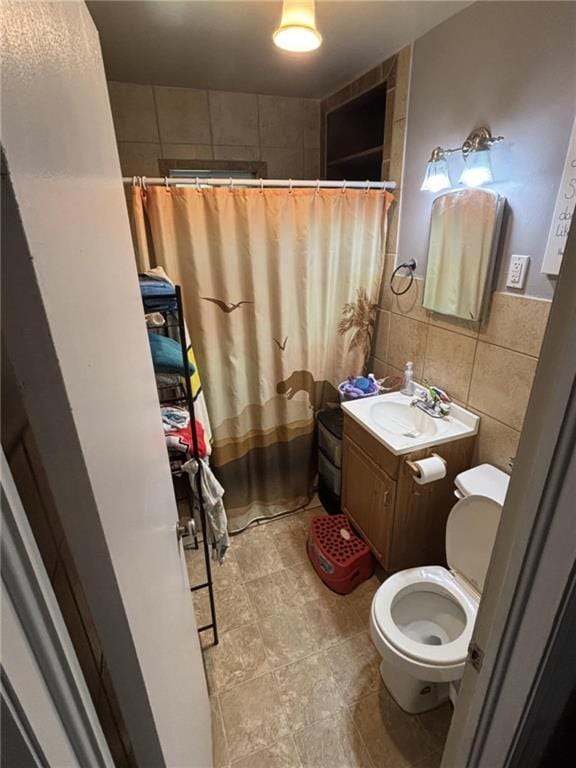 32592 SE 500th Rd, Kincaid, KS 66039 - bathroom featuring tile walls, vanity, and curtained shower