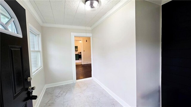 524 S Hill St, Fort Scott, KS 66701 - foyer featuring light marble finish flooring, healthy amount of natural light, ornamental molding, and baseboards
