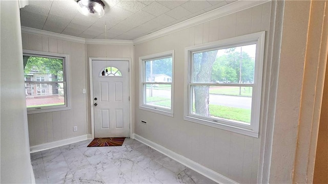 524 S Hill St, Fort Scott, KS 66701 - entryway with marble finish floors, crown molding, baseboards, and wood walls