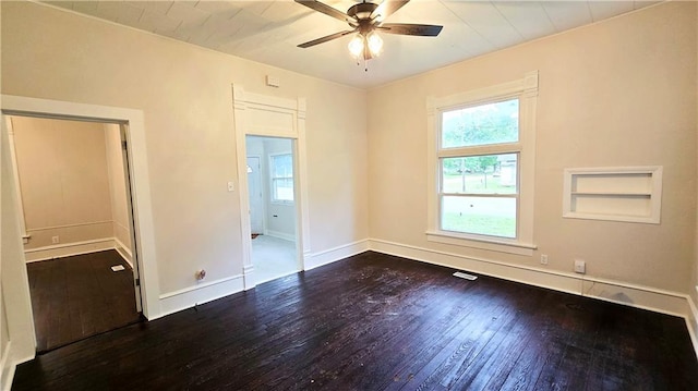 524 S Hill St, Fort Scott, KS 66701 - empty room featuring healthy amount of natural light, hardwood / wood-style floors, ceiling fan, and baseboards