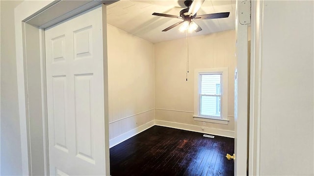 524 S Hill St, Fort Scott, KS 66701 - spare room featuring dark wood-type flooring, ceiling fan, and baseboards