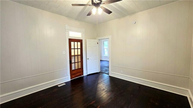 524 S Hill St, Fort Scott, KS 66701 - unfurnished room featuring dark wood finished floors, a ceiling fan, and baseboards