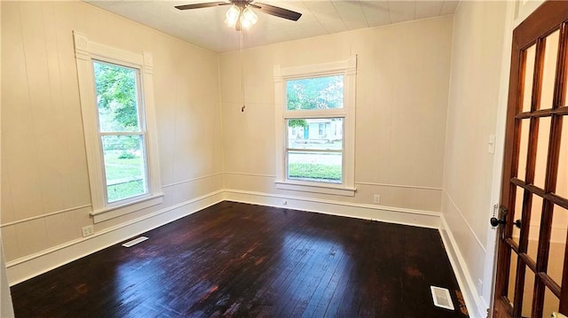 524 S Hill St, Fort Scott, KS 66701 - unfurnished room featuring dark wood-style flooring and ceiling fan