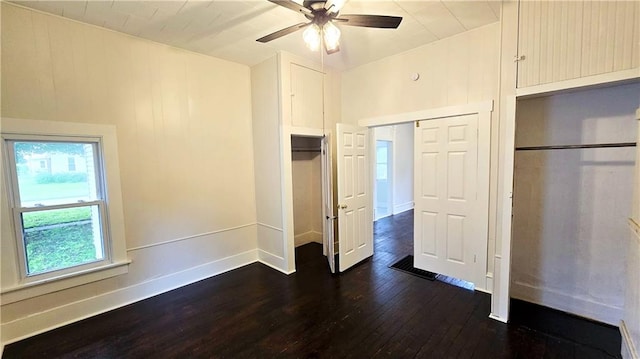 524 S Hill St, Fort Scott, KS 66701 - unfurnished bedroom with dark wood-style floors, baseboards, and ceiling fan