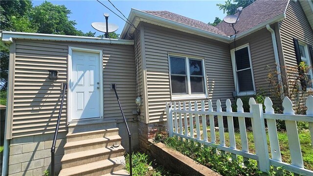524 S Hill St, Fort Scott, KS 66701 - doorway to property with a shingled roof