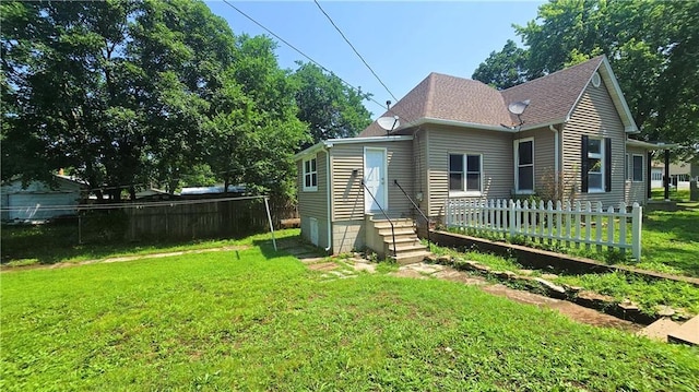 524 S Hill St, Fort Scott, KS 66701 - rear view of property with entry steps and roof with shingles