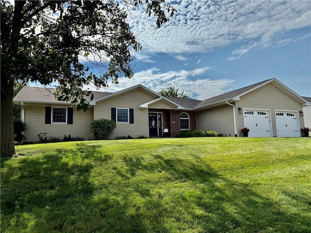 226 James Ave, Maryville, MO 64468 - ranch-style house featuring an attached garage, a front lawn, and roof with shingles