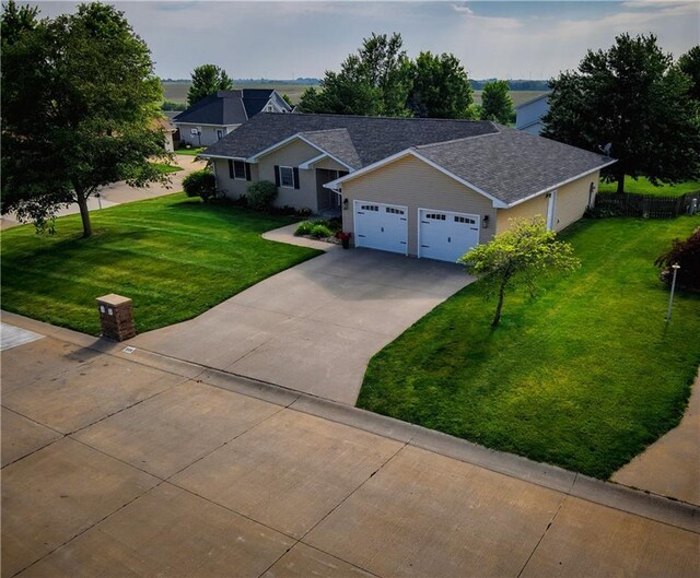 226 James Ave, Maryville, MO 64468 - single story home featuring a front yard, concrete driveway, and a garage