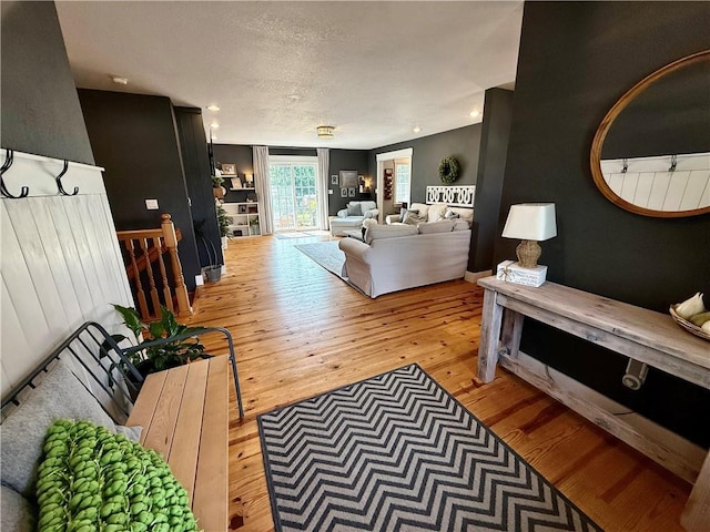 226 James Ave, Maryville, MO 64468 - living room with hardwood / wood-style flooring and a textured ceiling