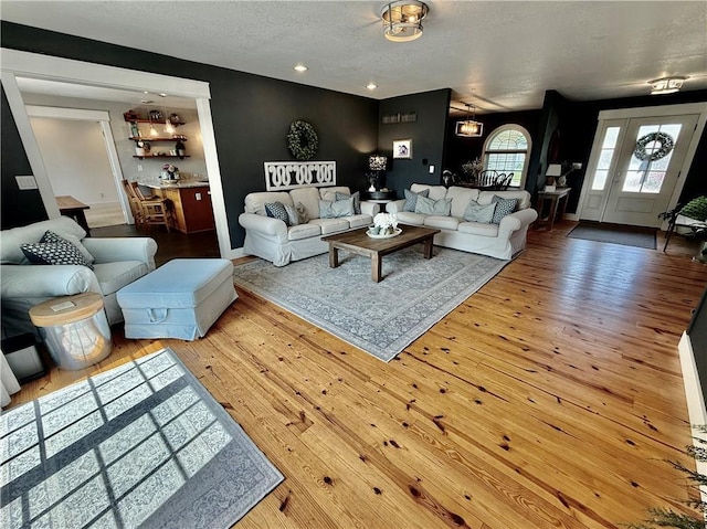 226 James Ave, Maryville, MO 64468 - living area with a textured ceiling, hardwood / wood-style flooring, recessed lighting, and baseboards