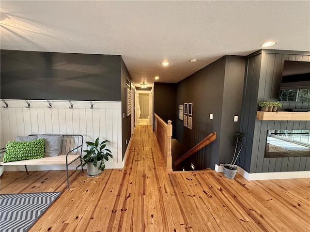 226 James Ave, Maryville, MO 64468 - hallway featuring hardwood / wood-style flooring, baseboards, recessed lighting, and a textured ceiling