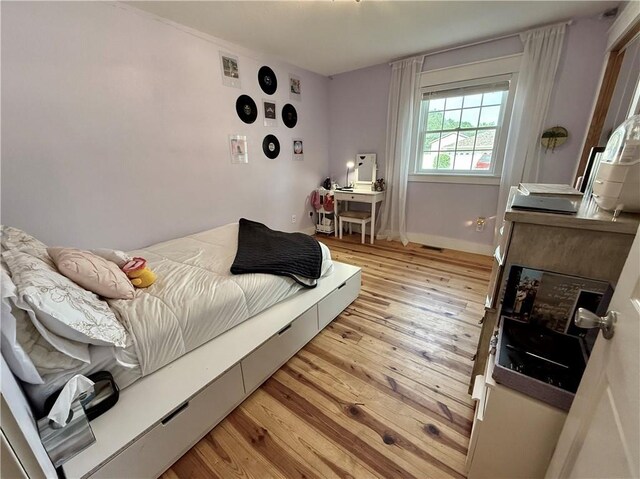 226 James Ave, Maryville, MO 64468 - bedroom with light wood-style flooring and baseboards