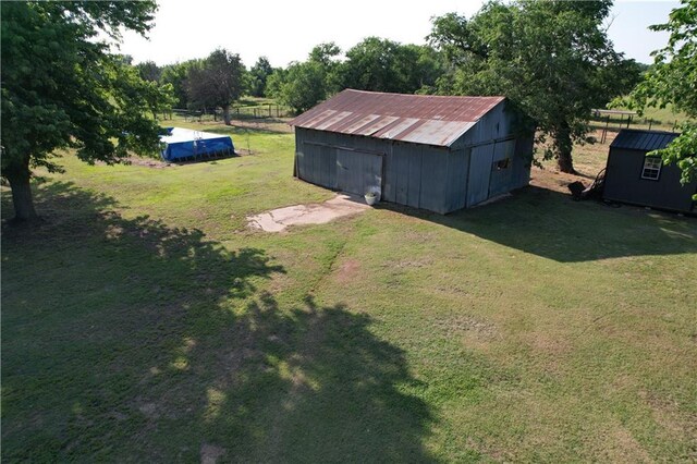 4004 Texaco Rd, Cushing, OK 74023 - view of green lawn with an outbuilding