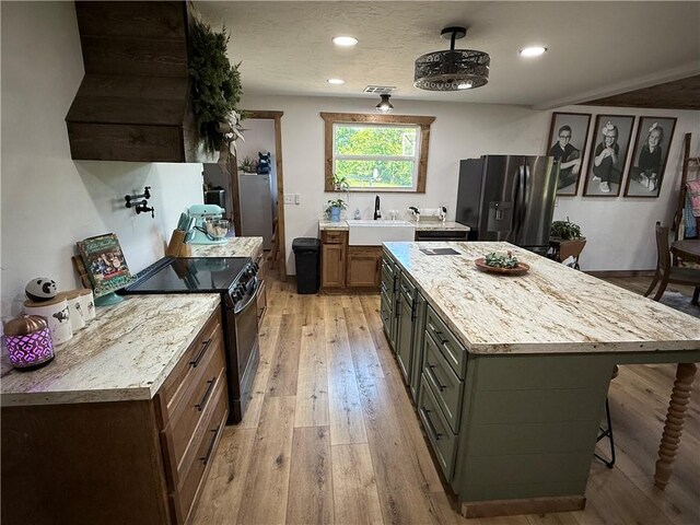 4004 Texaco Rd, Cushing, OK 74023 - kitchen featuring refrigerator with ice dispenser, range with electric cooktop, a sink, light wood-style floors, and ventilation hood