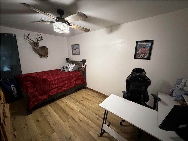 4004 Texaco Rd, Cushing, OK 74023 - bedroom with wood finished floors and ceiling fan