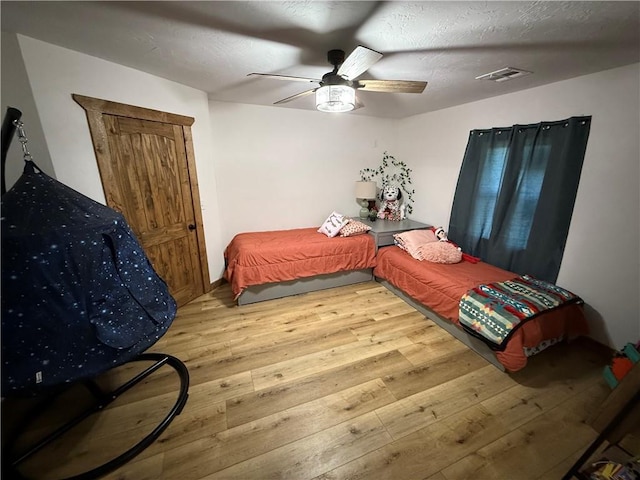 4004 Texaco Rd, Cushing, OK 74023 - bedroom featuring hardwood / wood-style flooring and a ceiling fan