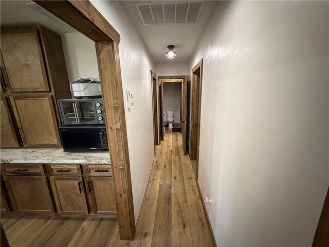 4004 Texaco Rd, Cushing, OK 74023 - hallway with light wood finished floors