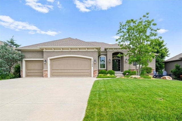 17208 W 198th St, Spring Hill, KS 66083 - view of front of home featuring an attached garage, driveway, a front yard, and stone siding
