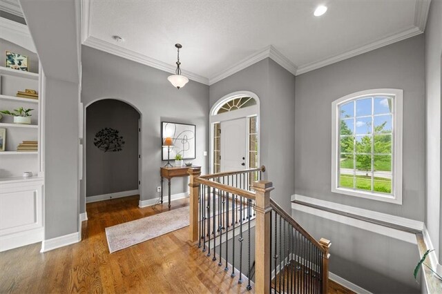 17208 W 198th St, Spring Hill, KS 66083 - entryway with arched walkways, wood finished floors, ornamental molding, and recessed lighting