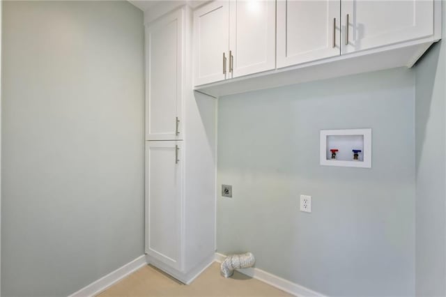 10775 Larsen St, Overland Park, KS 66210 - washroom with hookup for an electric dryer, baseboards, cabinet space, and hookup for a washing machine