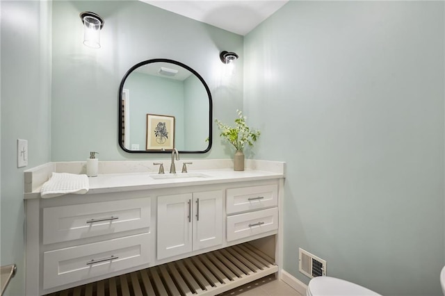 10775 Larsen St, Overland Park, KS 66210 - bathroom with toilet, vanity, and tile patterned floors