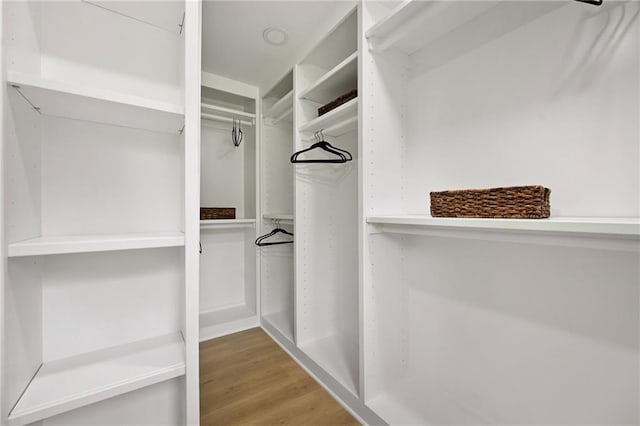 10775 Larsen St, Overland Park, KS 66210 - walk in closet with wood finished floors