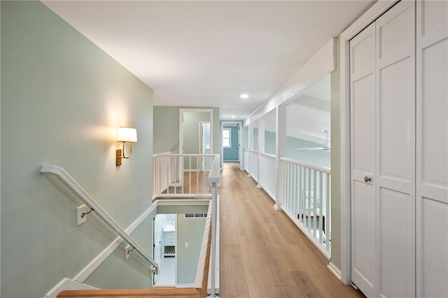 10775 Larsen St, Overland Park, KS 66210 - corridor featuring an upstairs landing, light wood-type flooring, and recessed lighting