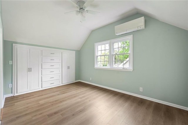 10775 Larsen St, Overland Park, KS 66210 - additional living space with a wall unit AC, wood finished floors, a ceiling fan, lofted ceiling, and baseboards