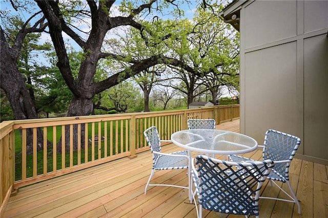 10775 Larsen St, Overland Park, KS 66210 - wooden deck featuring outdoor dining space