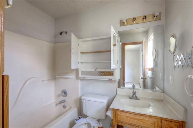1609 N Lazy Branch Rd, Independence, MO 64058 - bathroom with toilet, vanity, a textured ceiling, and bathtub / shower combination
