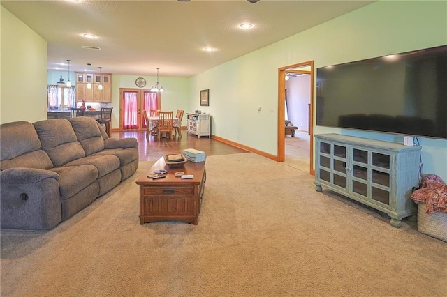 5260 SE Fox Run Rd, Lathrop, MO 64465 - living area with carpet floors, a chandelier, recessed lighting, and baseboards