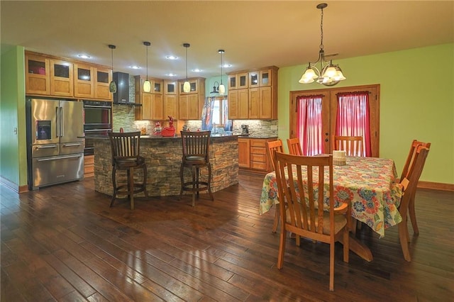 5260 SE Fox Run Rd, Lathrop, MO 64465 - dining room featuring dark wood-type flooring, a chandelier, french doors, recessed lighting, and baseboards