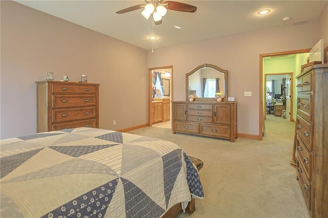 5260 SE Fox Run Rd, Lathrop, MO 64465 - bedroom featuring light colored carpet, baseboards, ceiling fan, and connected bathroom