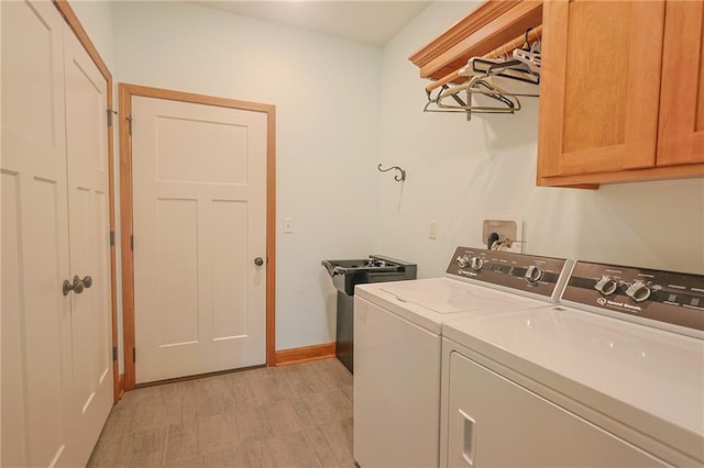 5260 SE Fox Run Rd, Lathrop, MO 64465 - laundry room featuring cabinet space, washer and dryer, and baseboards