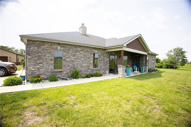 5260 SE Fox Run Rd, Lathrop, MO 64465 - rear view of property with a chimney, a yard, and stone siding