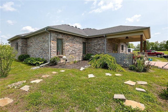 5260 SE Fox Run Rd, Lathrop, MO 64465 - view of side of property with a yard and stone siding