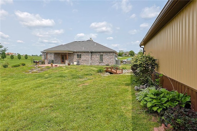 5260 SE Fox Run Rd, Lathrop, MO 64465 - view of grassy yard featuring a patio area