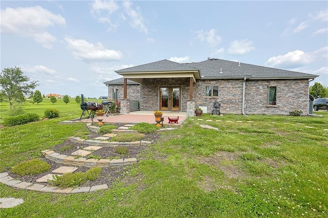 5260 SE Fox Run Rd, Lathrop, MO 64465 - rear view of house featuring french doors, a patio area, a lawn, stone siding, and a shingled roof