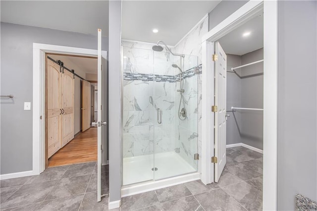 3931 Main St, Parsons, KS 67357 - bathroom with a shower stall, baseboards, tile patterned flooring, and recessed lighting