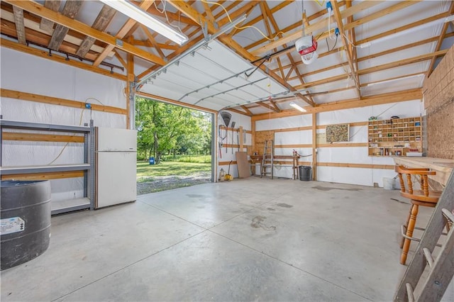 3931 Main St, Parsons, KS 67357 - garage featuring freestanding refrigerator